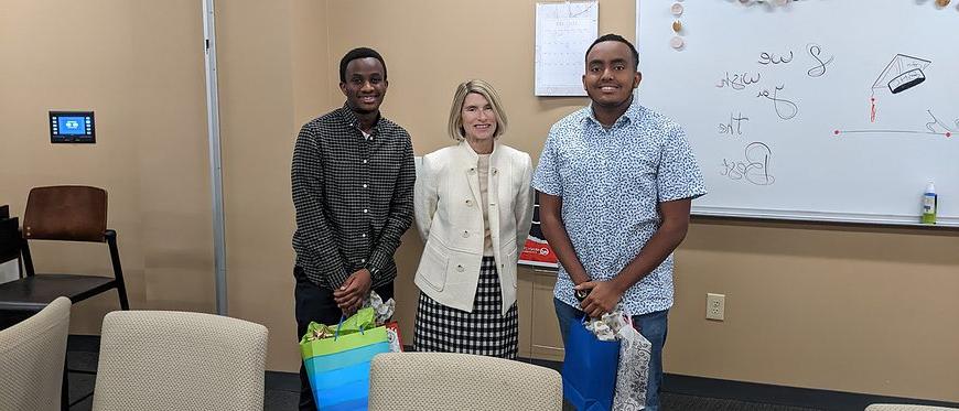 3 people smiling for a picture