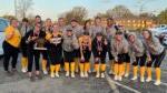 垒球 players and coaches smiling at camera with Arrowhead Conference Championship trophy & 奖牌